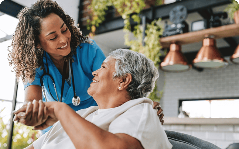 Caregiver supporting senior in home setting
